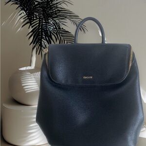 DKNY Top Zip With Handle, Black Backpack, Bag. Back straps show signs of stress
